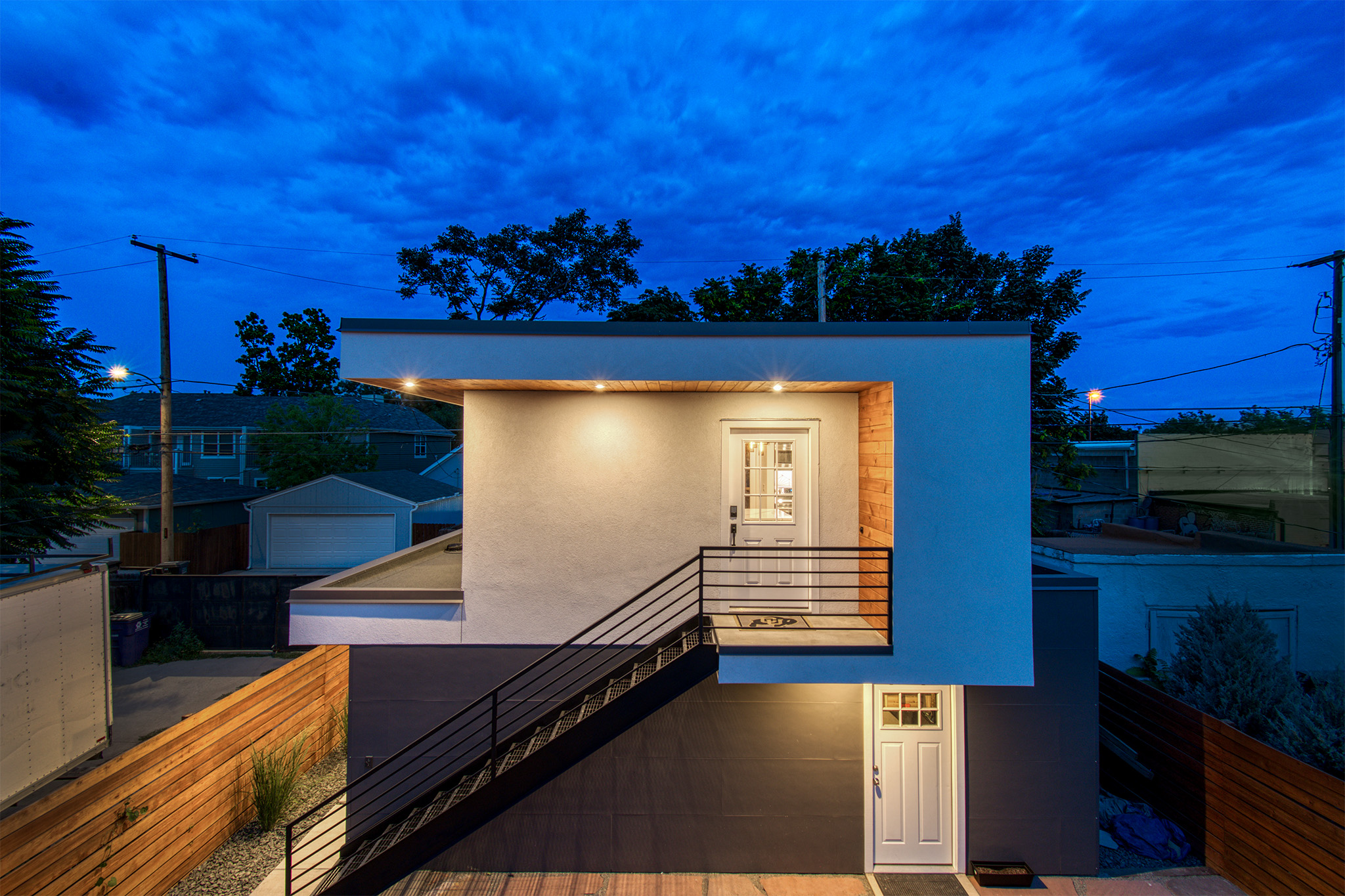 Exterior of Cole Denver carriage house rental with elevated entry and private garage